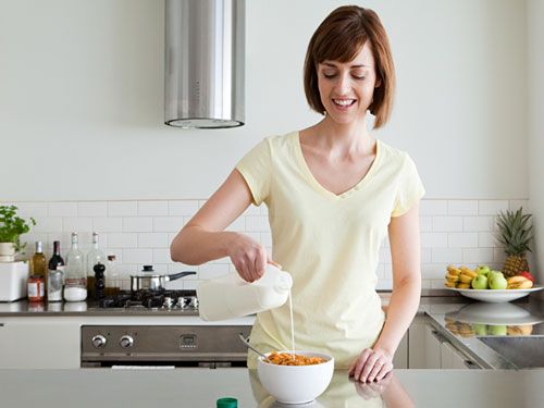 Woman-Breakfast-Pouring-Milk