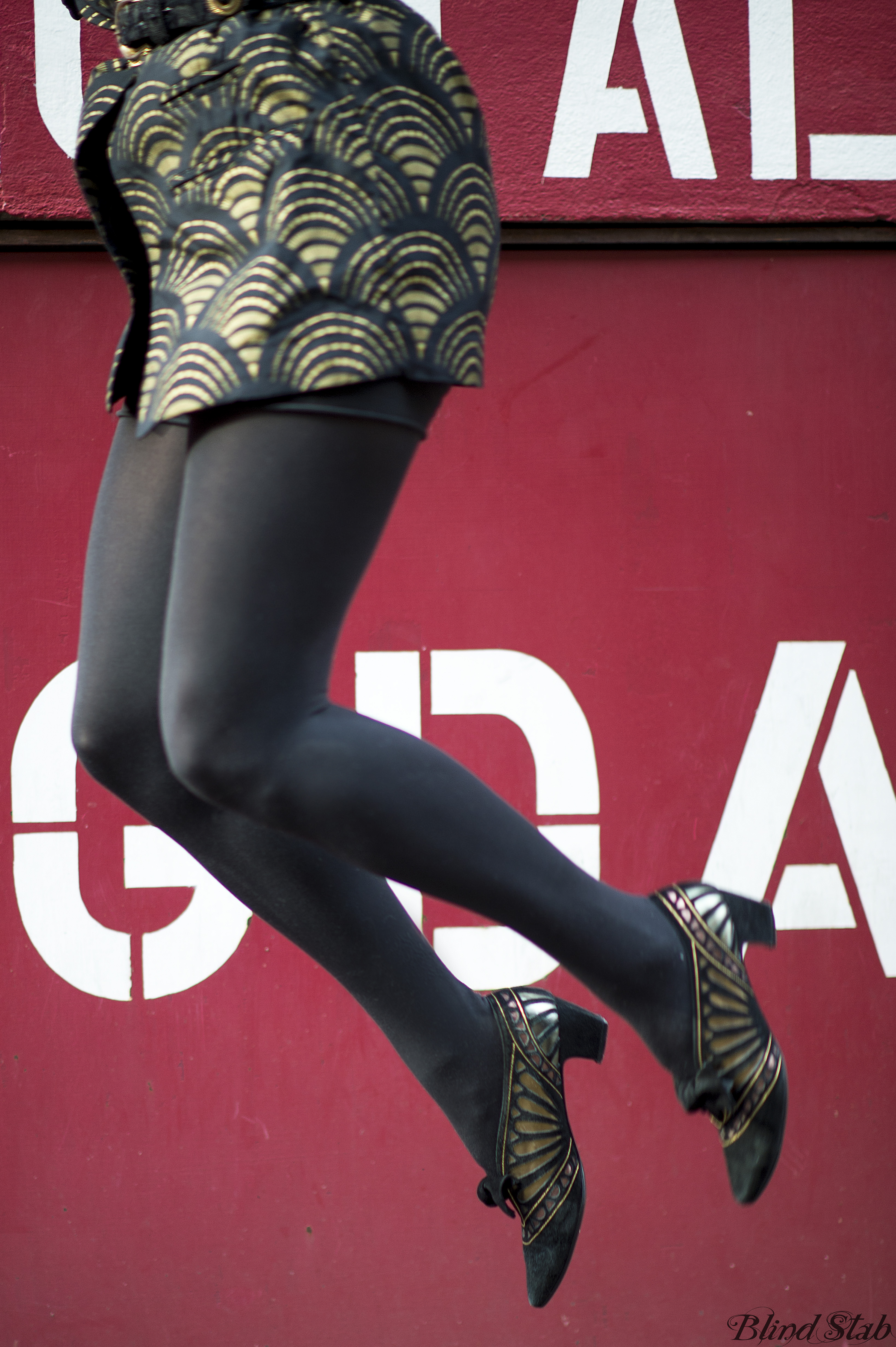 Curvy-Woman-Model-Jumping-Gold-Heels