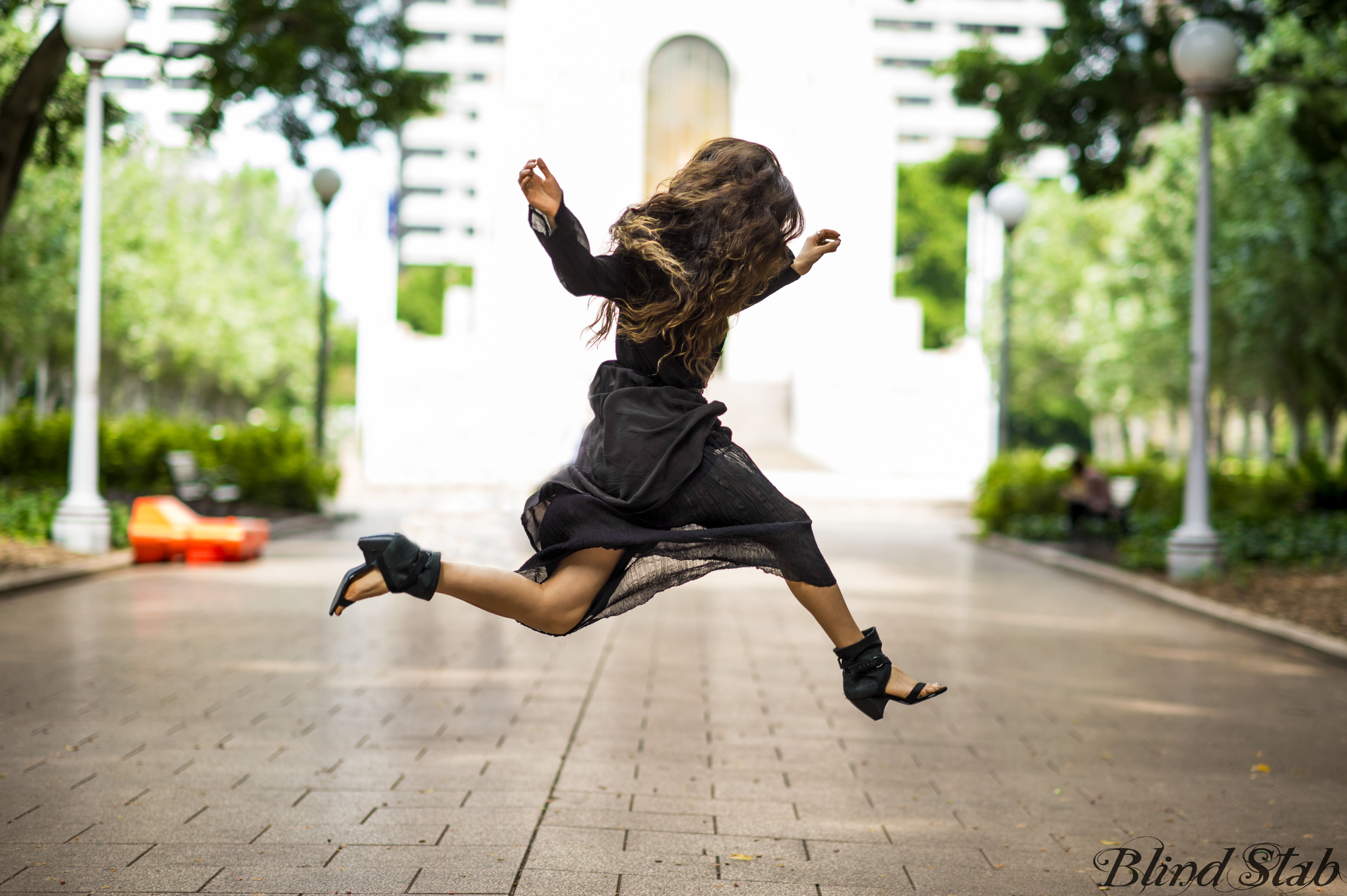 Girl-Jumping-Streetstyle-Goth-Black-Dress-Long-Hair