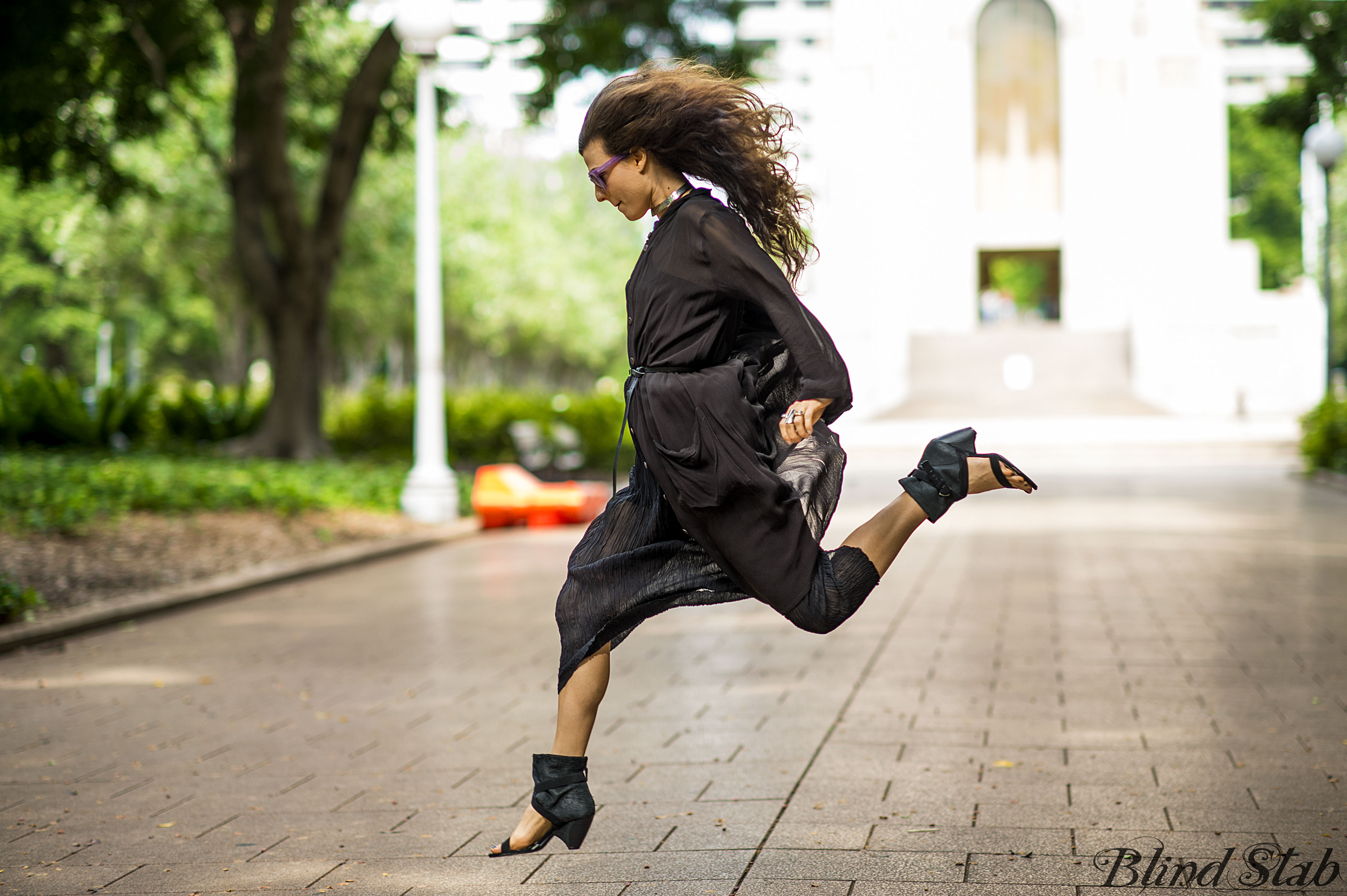 Girl-Jumping-Streetstyle-Goth-Black-Dress-Long-Hair