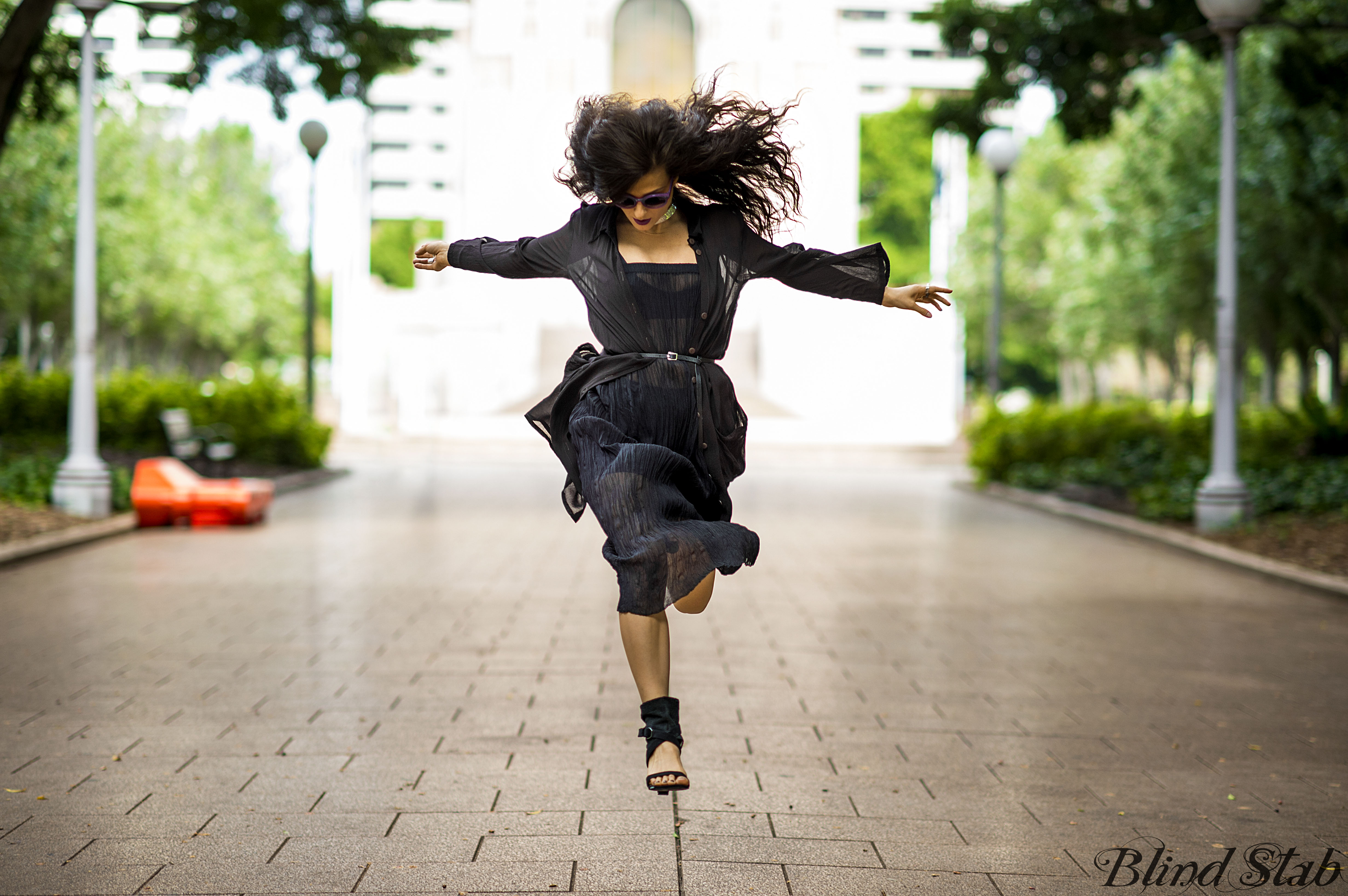 Girl-Jumping-Streetstyle-Goth-Black-Dress-Long-Hair