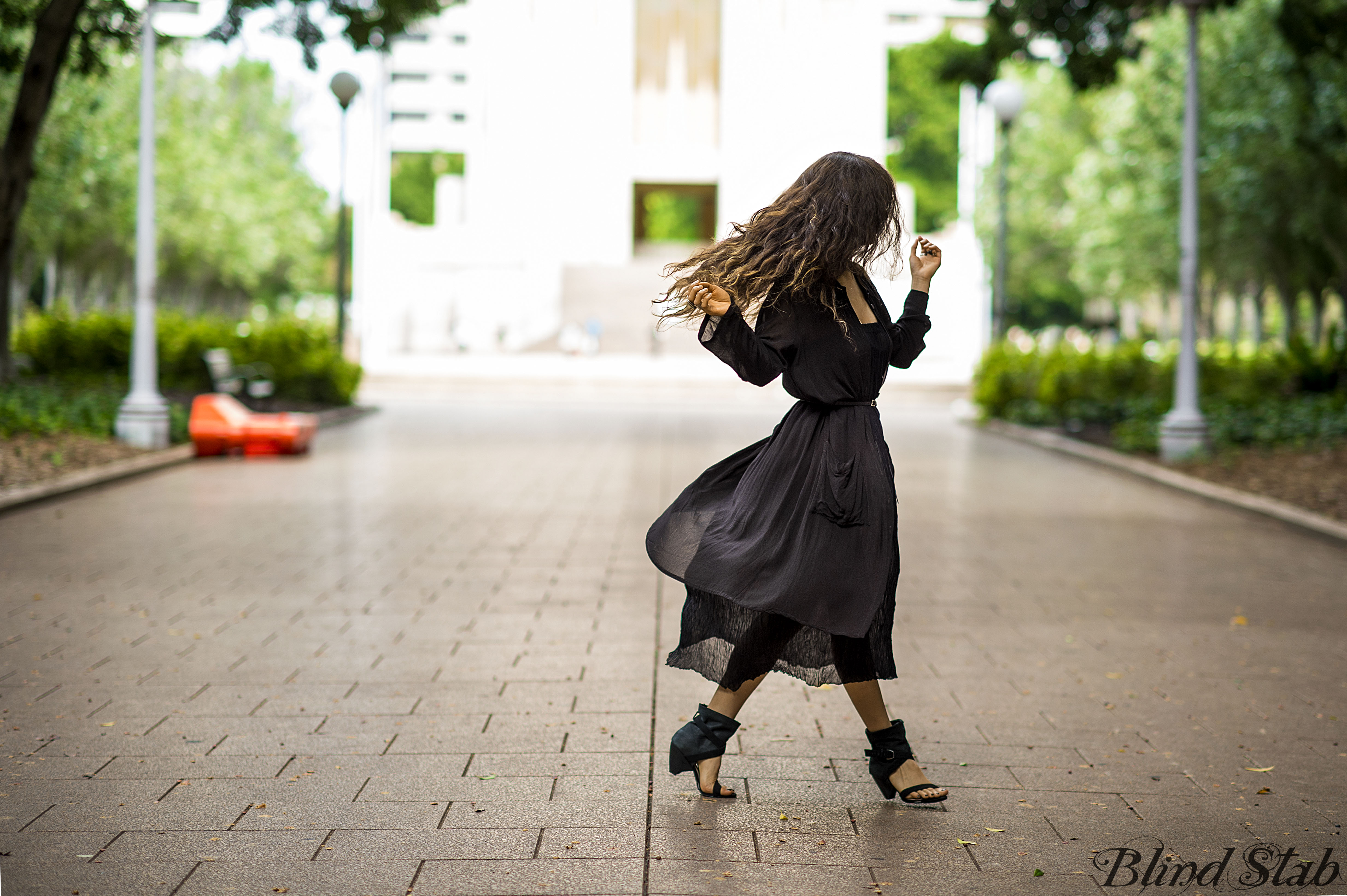 Girl-Jumping-Streetstyle-Goth-Black-Dress-Long-Hair