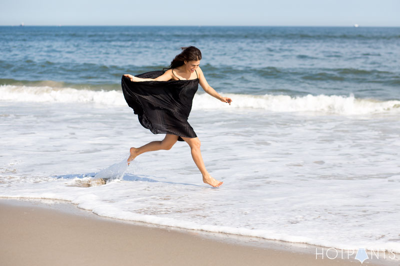 Long Hair Girl Playing At The Beach Ocean