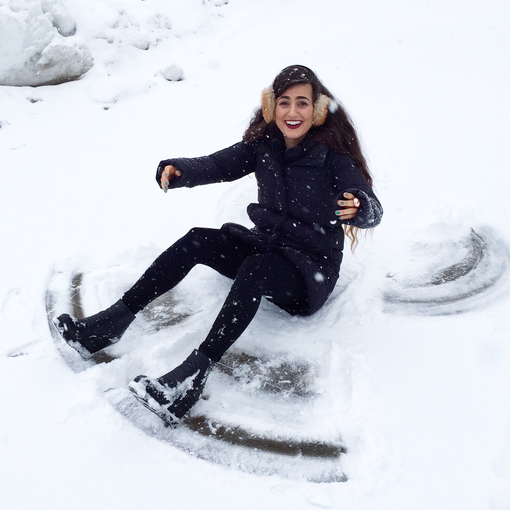 Funny Girl Playing in the Snow Making Snowmen